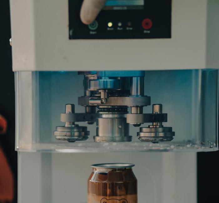 A can sealing machine in action